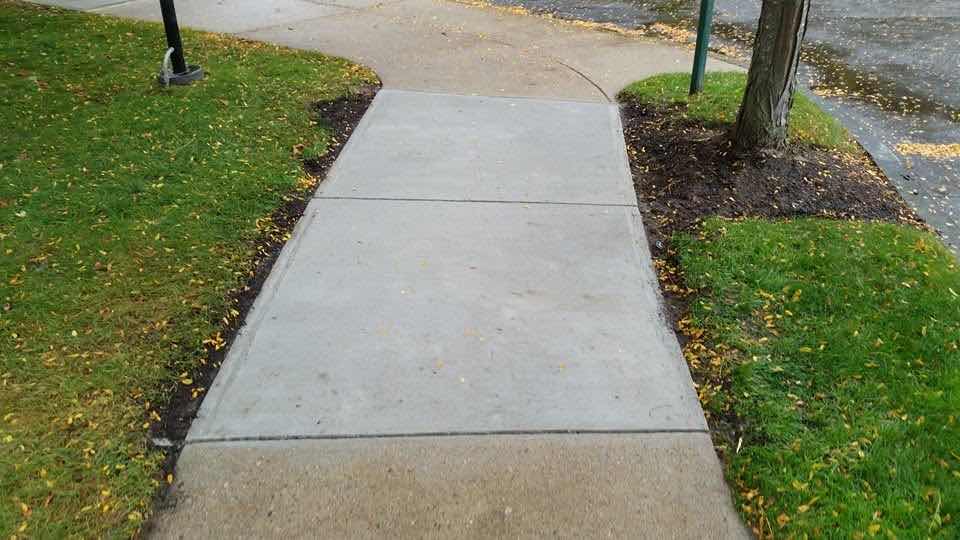 New poured concrete sidewalk installed by Magic Tools Contracting
