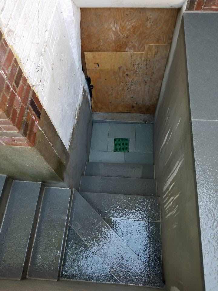 Brick and bluestone basement walkout stairwell, built by Magic Tools Contracting